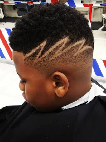Kids haircut with a custom lightning bolt hair design